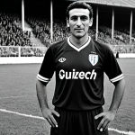 Swiss Football Legend**

"A black and white portrait of Kubi Türkyilmaz in his prime, wearing a classic Grasshopper Club Zurich jersey, fully clothed, modest, appropriate attire, on a vintage football field, safe for work, professional, perfect anatomy, correct proportions, high quality."

**