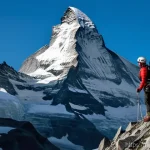 Home 14 마터호른 등산 정보 - **Prompt:** A brave and determined female mountain climber, in her late 20s, fully dressed in warm, ...